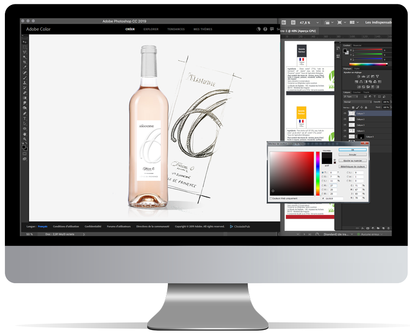 Design et création d'étiquette de vin en prépresse sur Mac dans un studio d'infographie